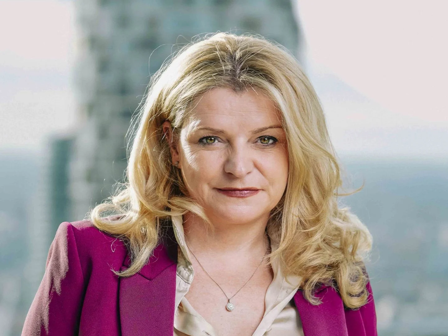 Smiling woman with blonde hair